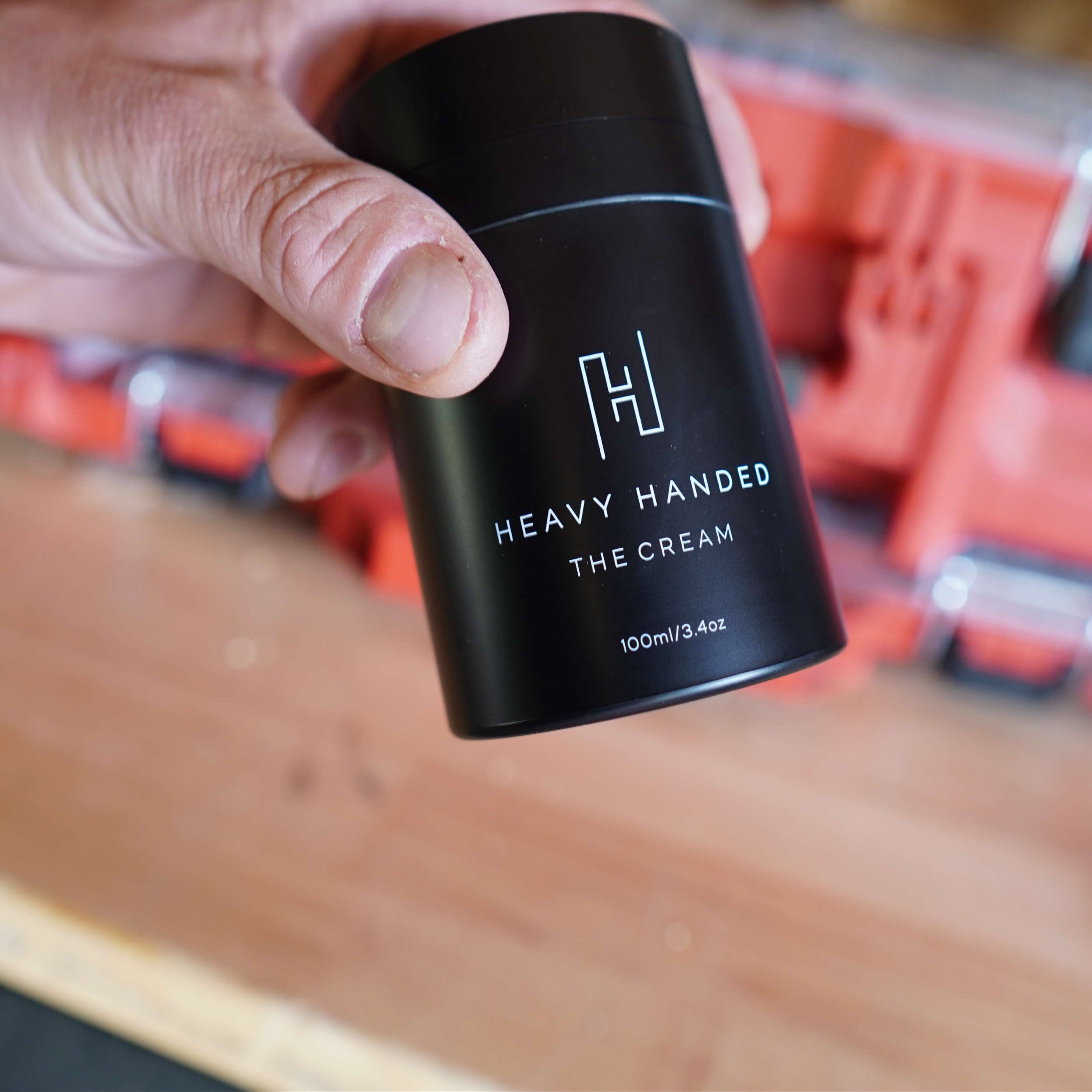 Mechanic hand holding Heavy handed The Cream