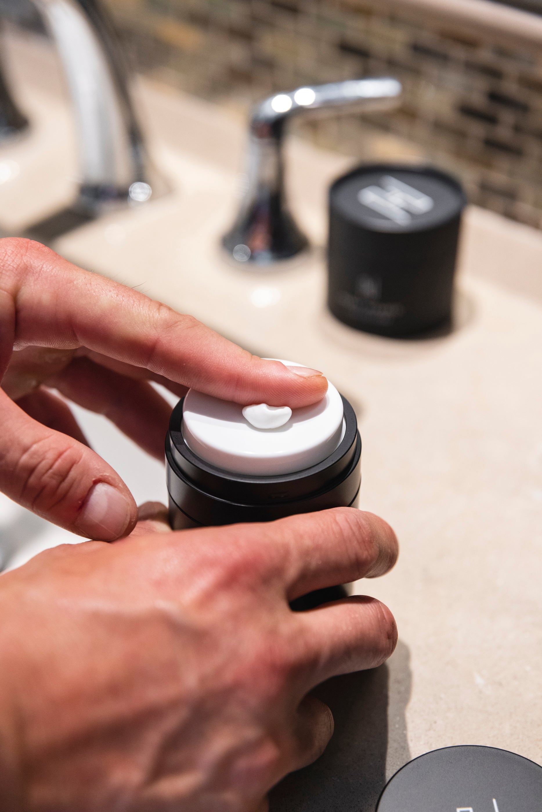 Applying Heavy Handed's The Cream to hands.